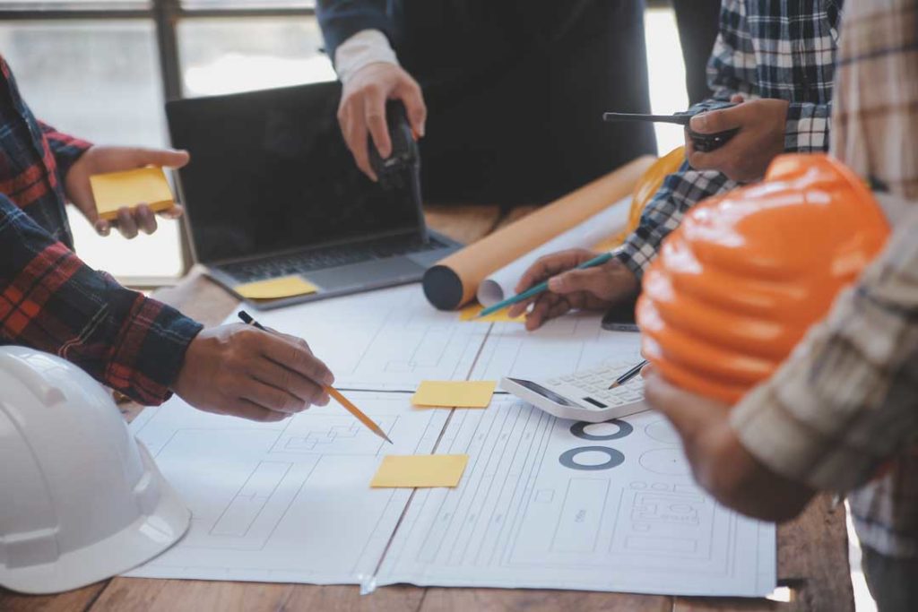 Engineer Teamwork Meeting, Drawing Working On Blueprint Meeting